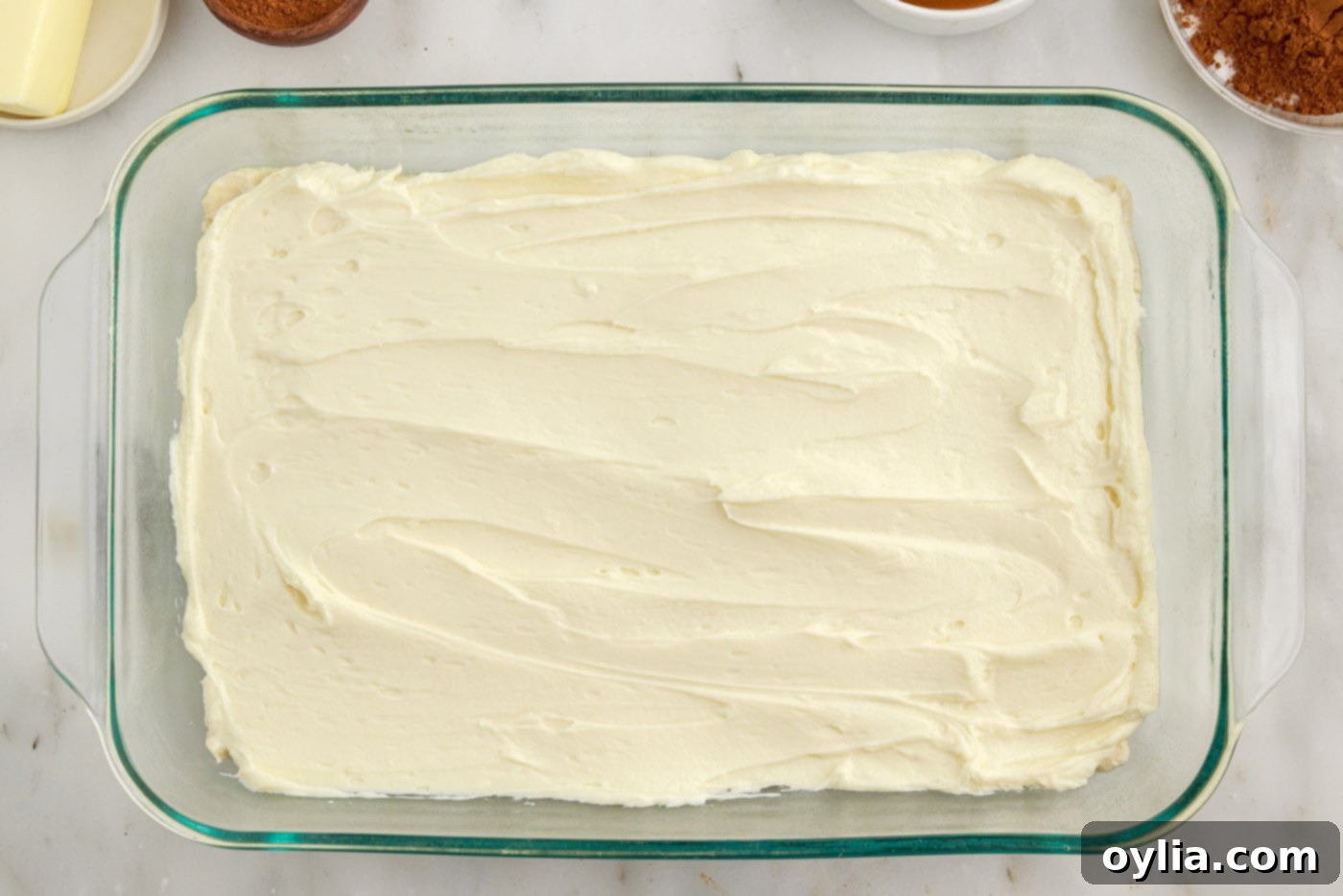 cheesecake layered on top of crescent dough in a baking dish