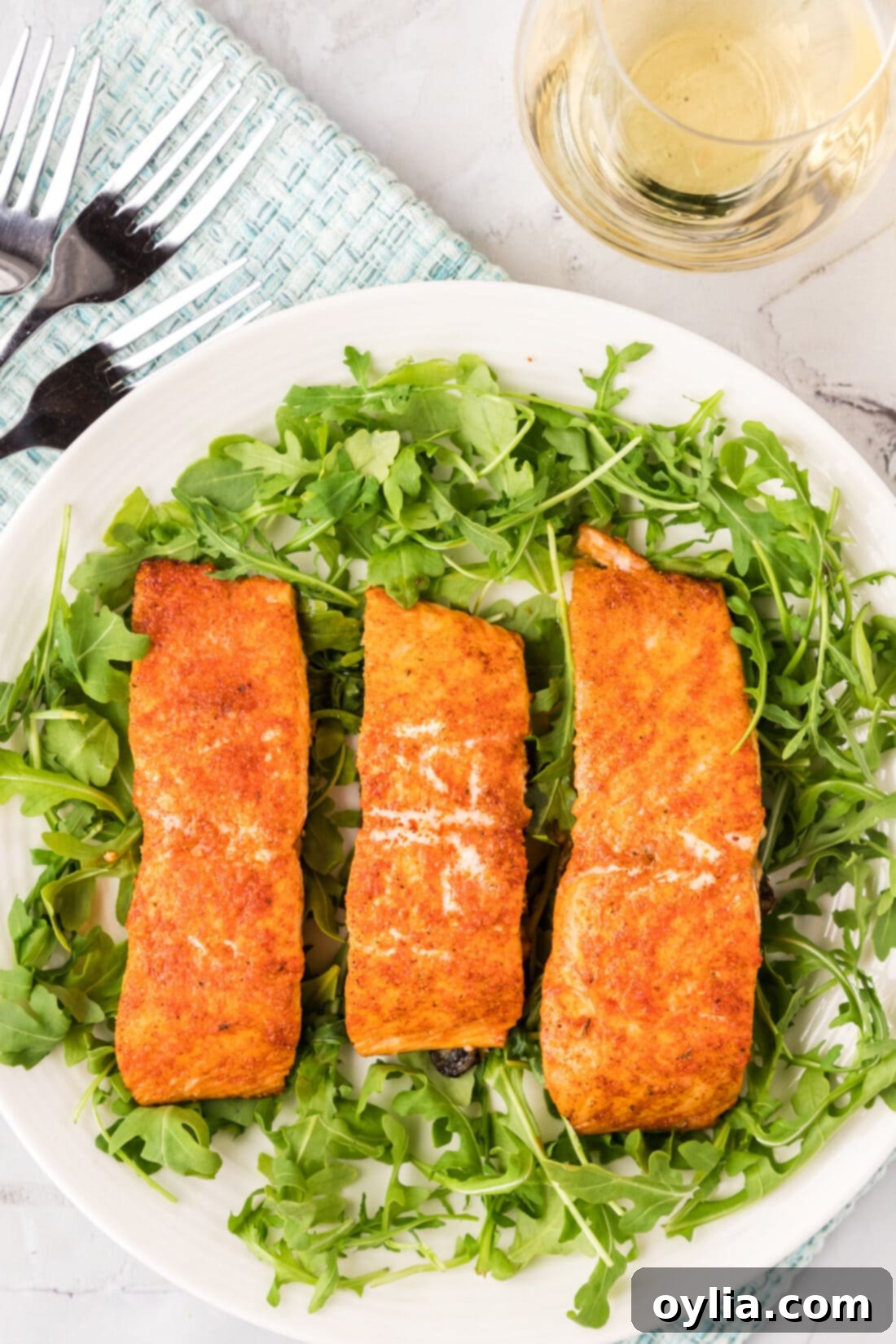 Roasted Salmon served on a bed of greens
