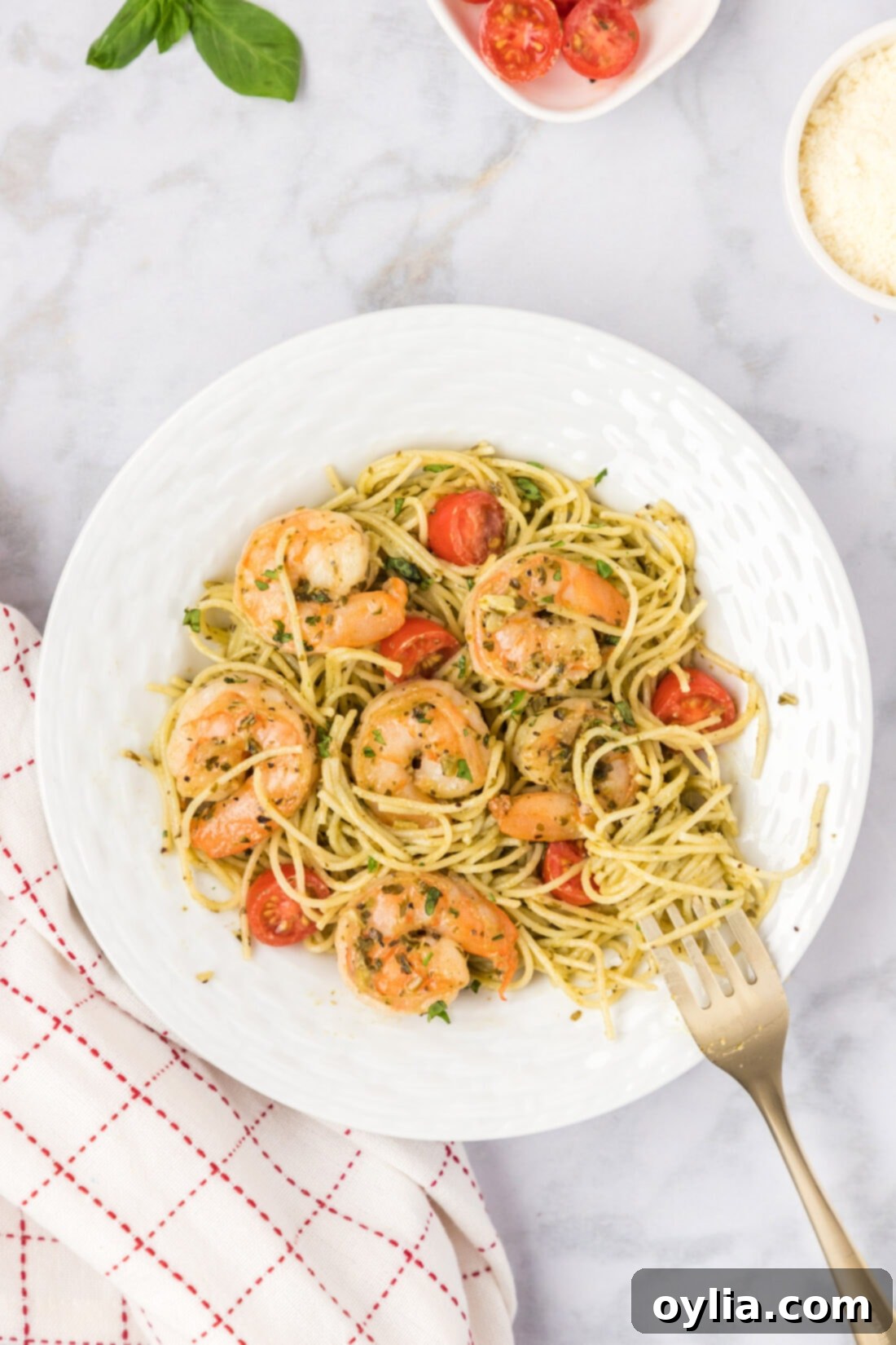 Fresh Pesto Shrimp Pasta 2 Plate of Shrimp Pesto Pasta, garnished with fresh basil and cherry tomatoes