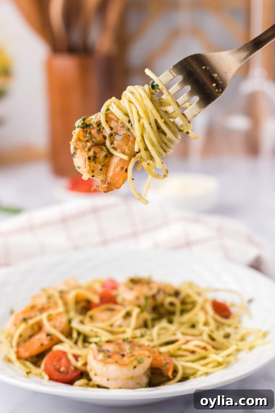 Fresh Pesto Shrimp Pasta 3 Shrimp Pesto Pasta on a fork, showing the creamy sauce and tender shrimp