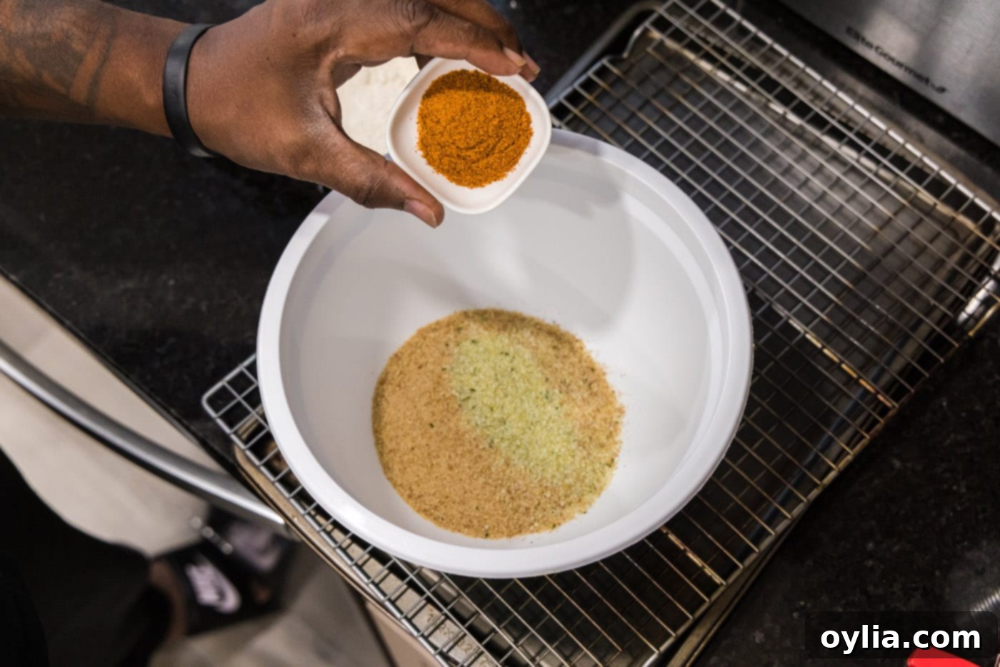 breadcrumbs, garlic salt, and old bay seasoning in a mixing bowl