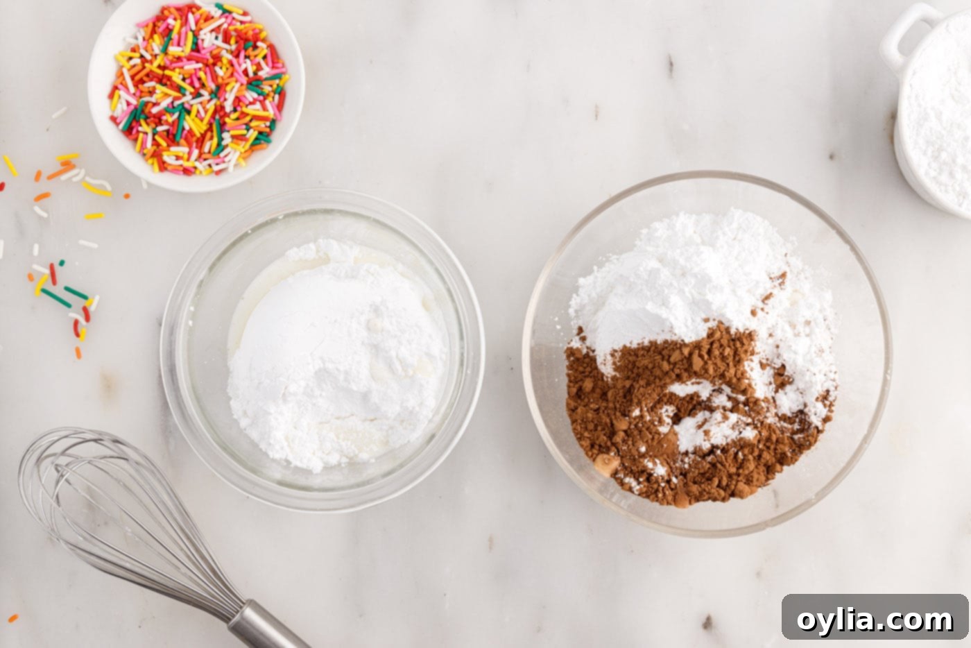 cocoa powder and powdered sugar in a bowl next to powdered sugar and milk in a bowl