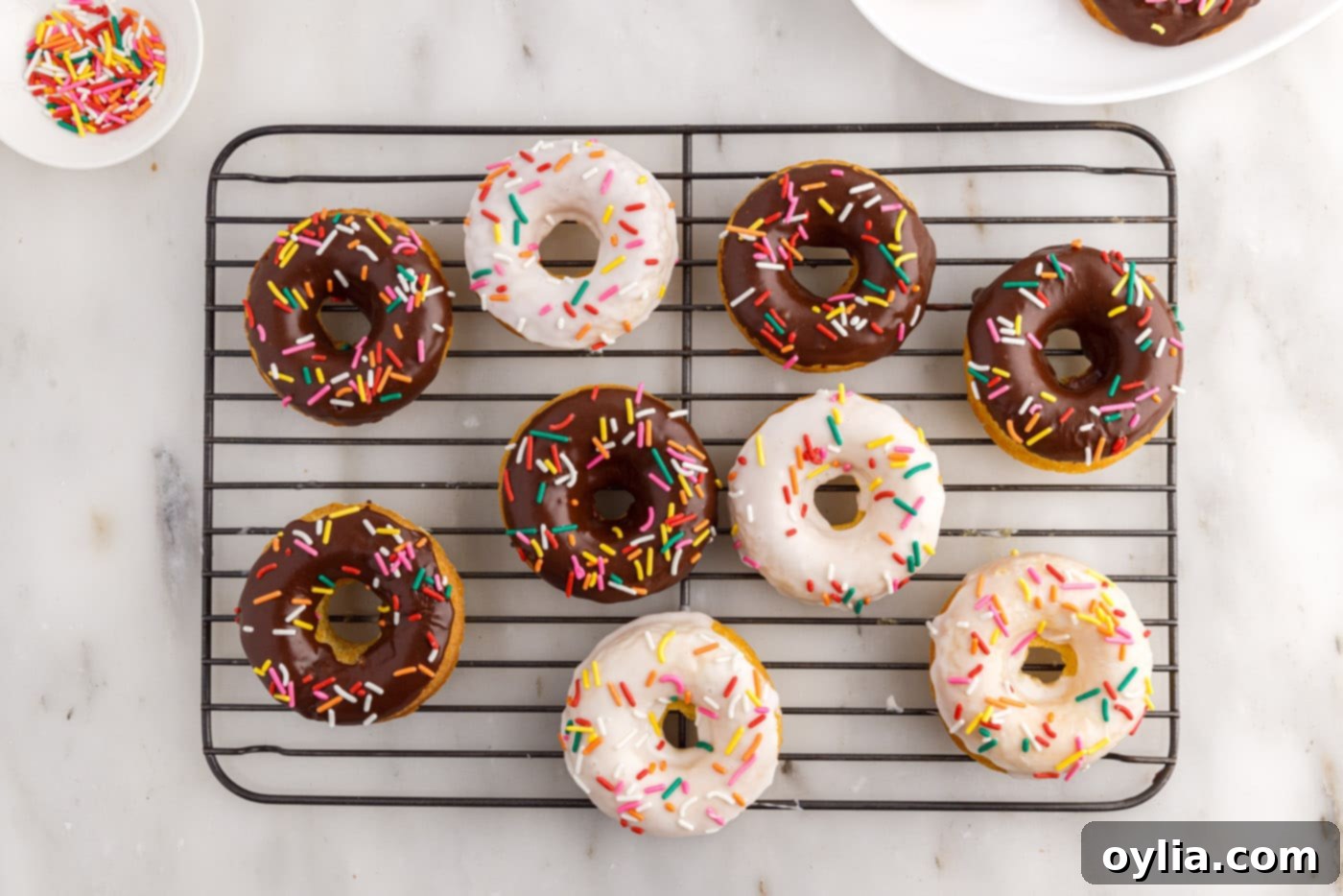 cake mix donuts with vanilla and chocolate glaze topped with sprinkles
