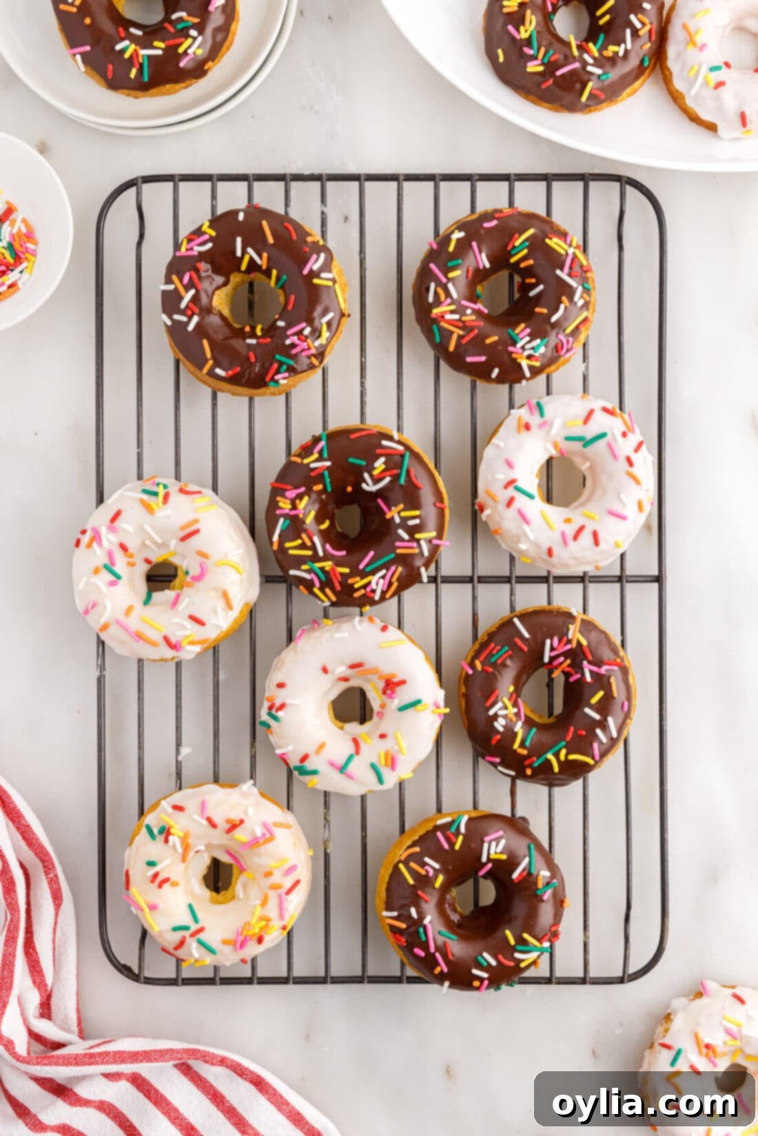 Cake Mix Donuts resting on a wire cooling rack