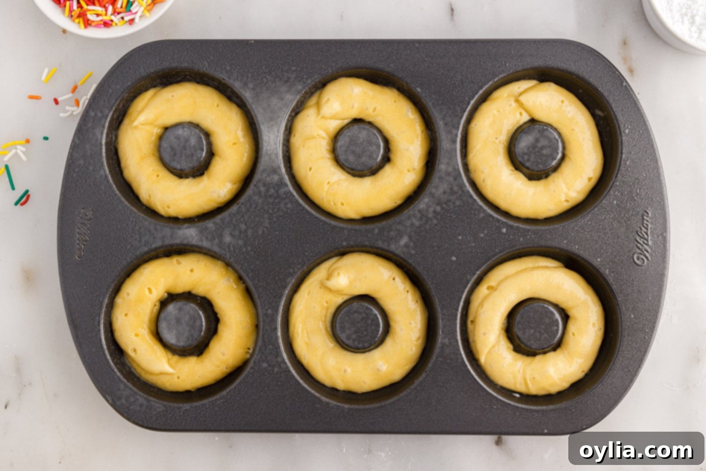 donut batter in a pan