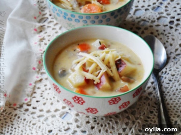 A close up photo of rustic garlic potato soup in a bowl.