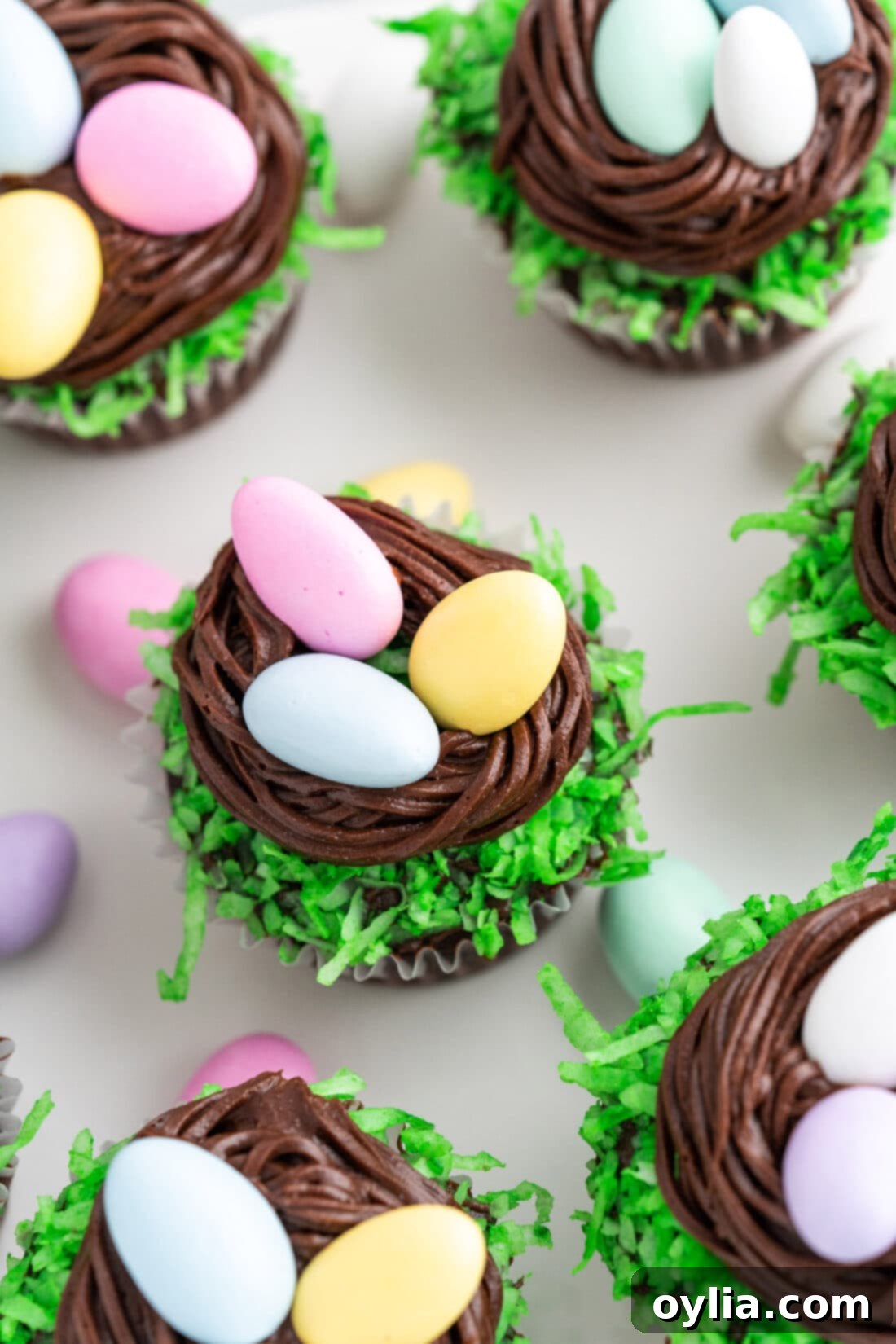A plate full of beautifully decorated Easter Nest Cupcakes, showcasing their festive and delightful appearance