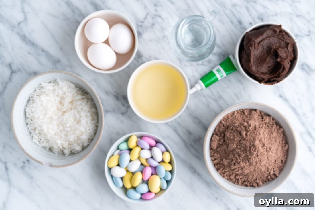 Array of ingredients for Easy Easter Nest Cupcakes, including cake mix, frosting, coconut, and candy eggs