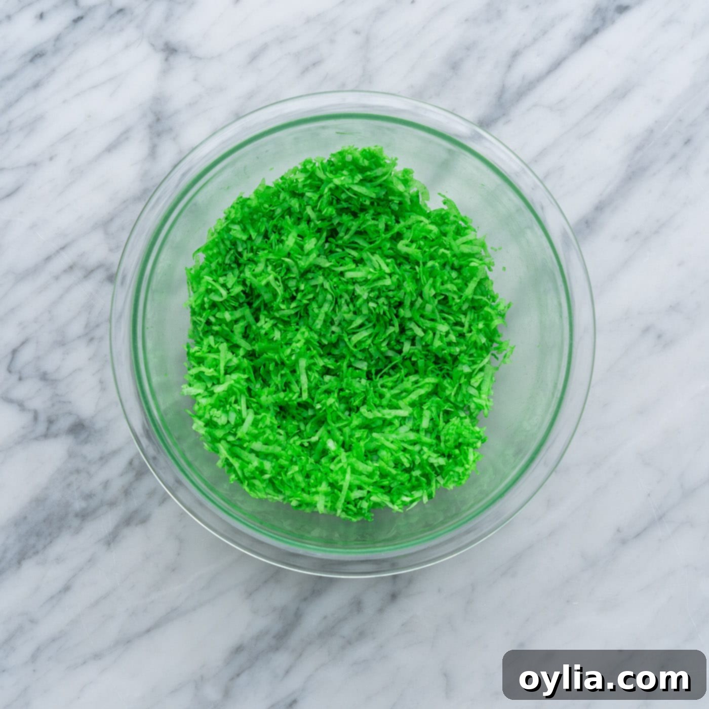 green tinted shredded coconut in a bowl
