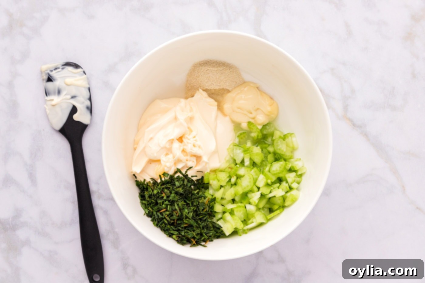 Gourmet Shrimp Roll 7 shrimp roll ingredients in a mixing bowl