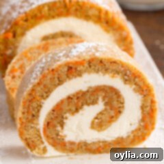 Carrot Cake Swiss Roll 21 Close up photo of a Carrot Cake Roll slice, revealing the perfect spiral