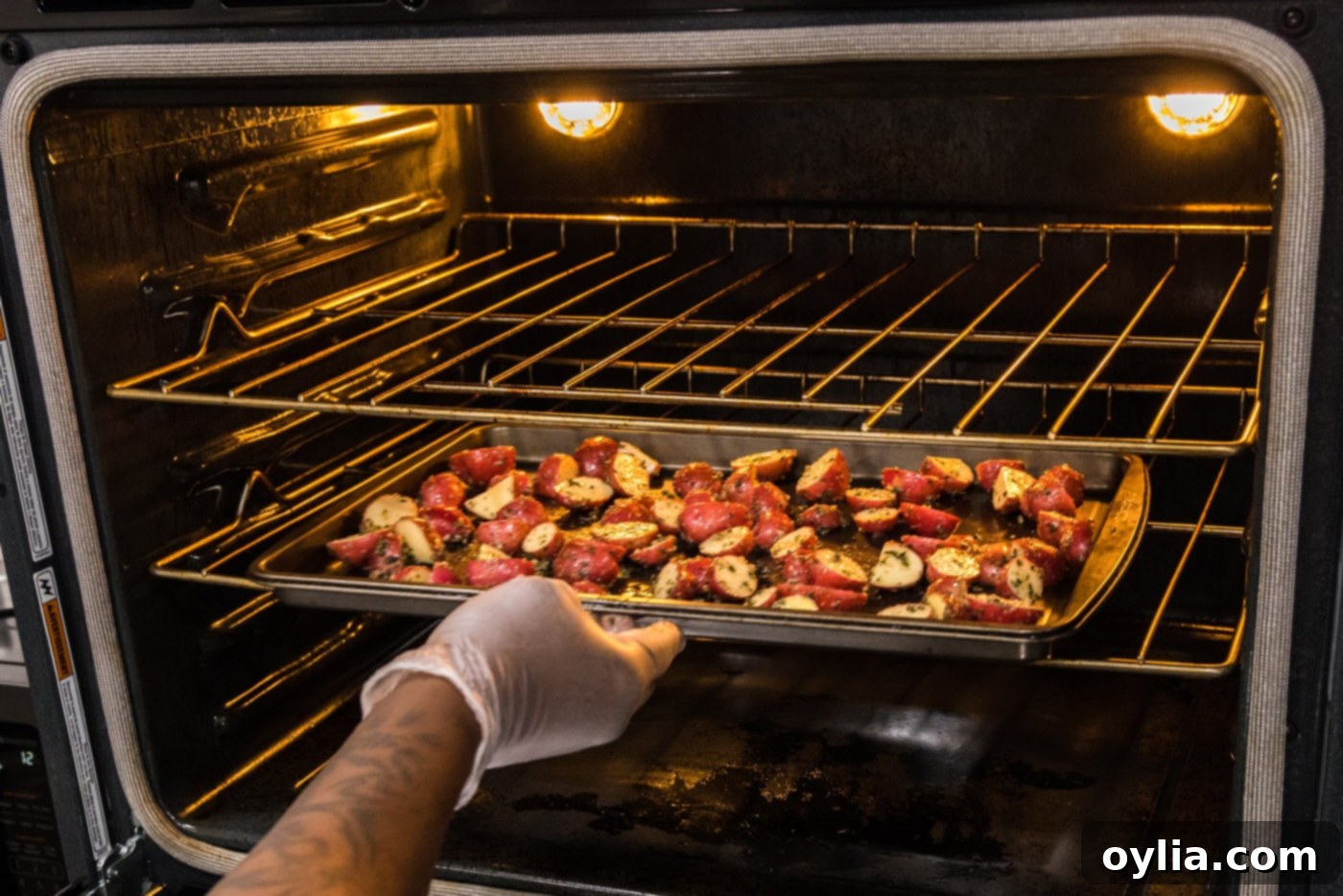 red potatoes on a baking sheet in the oven