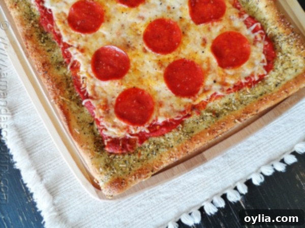 A close up overhead photo of garlic bread crusted classic pizza.