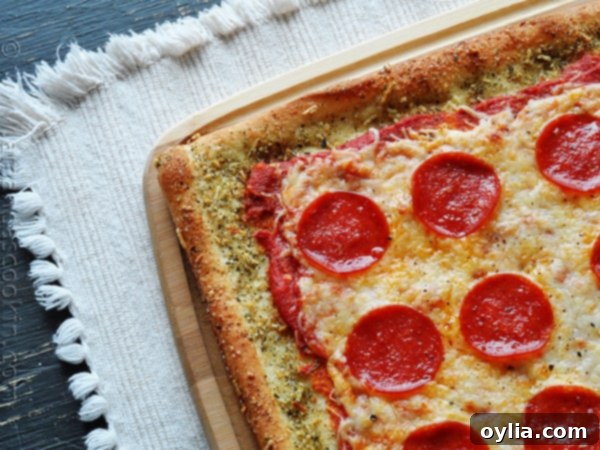 A close up photo of garlic bread crusted classic pizza.
