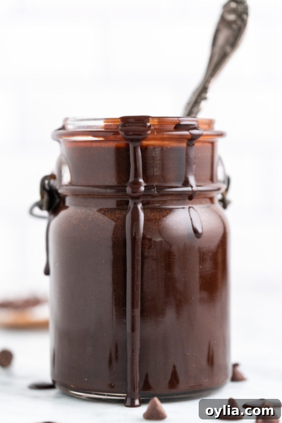 Hot Fudge in a jar with a spoon