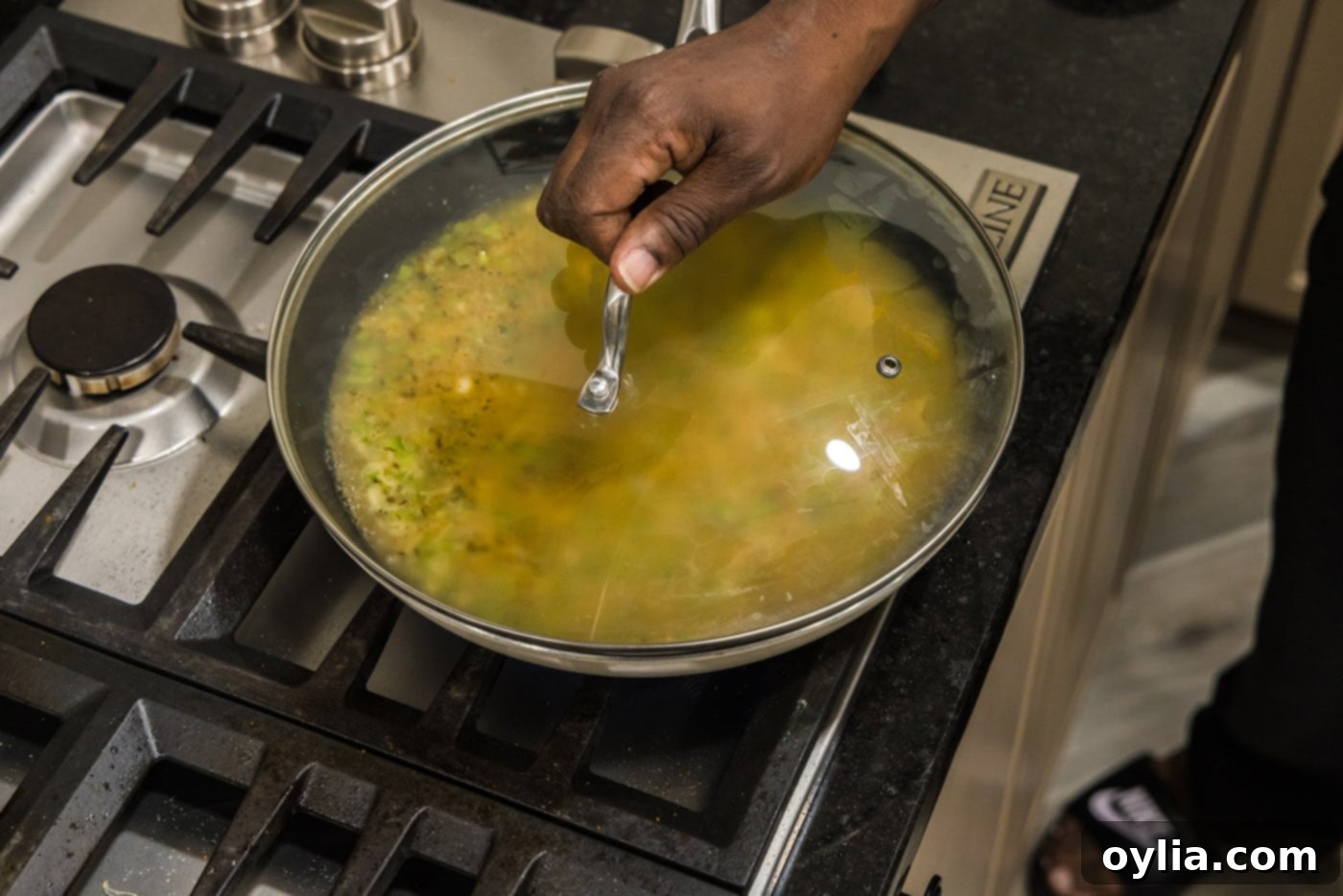 putting lid on skillet while making cajun rice