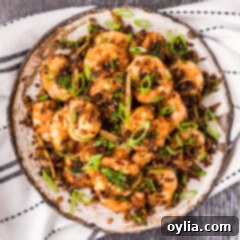 Overhead photo of a plate of Salt and Pepper Shrimp, beautifully arranged.