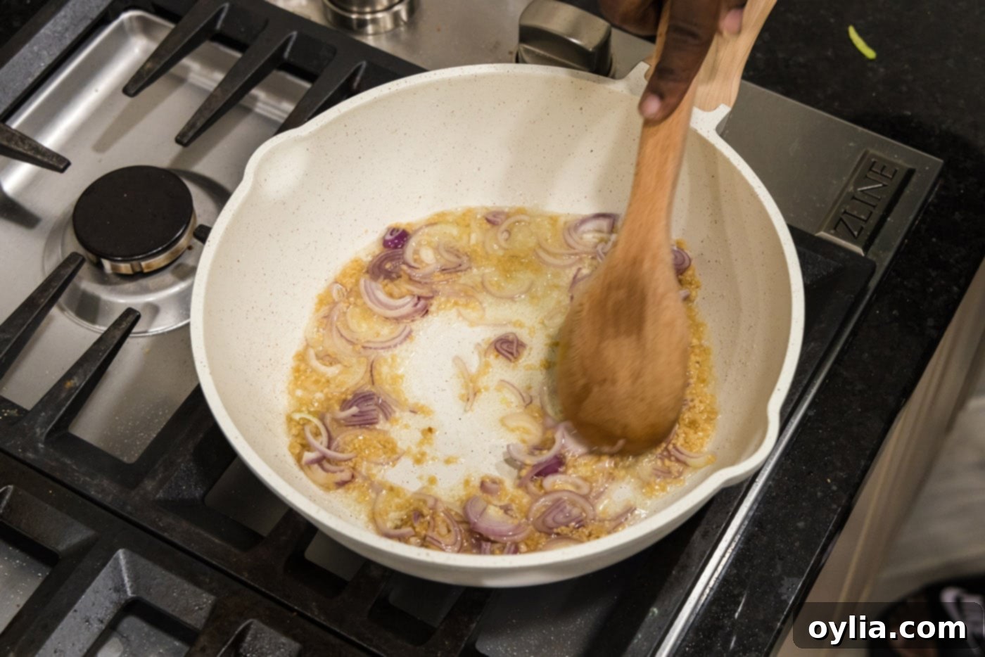 mixing shallots and garlics in a pan
