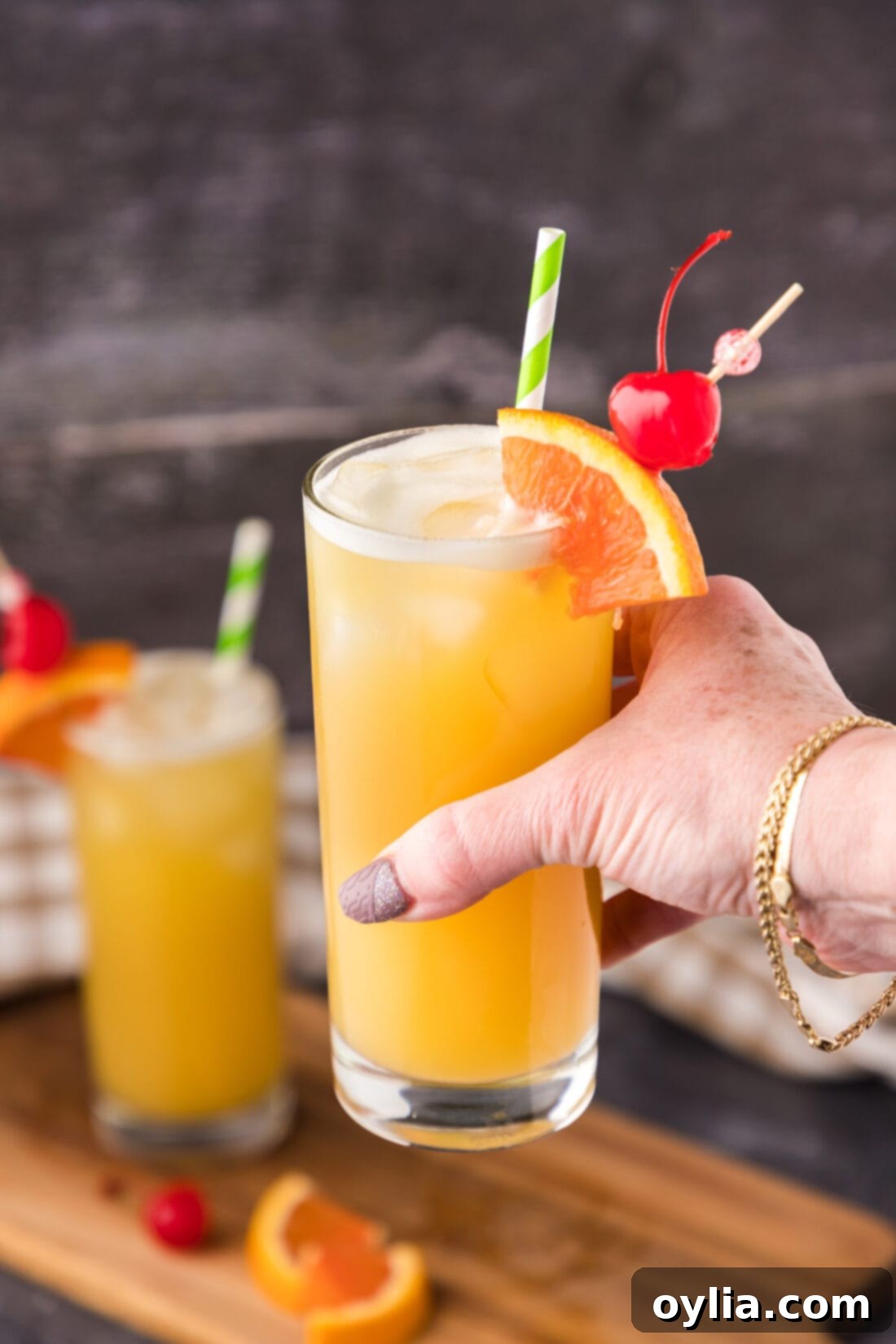 The Loose Cannon Cocktail 2 Hand holding up a Skrew Loose Cocktail