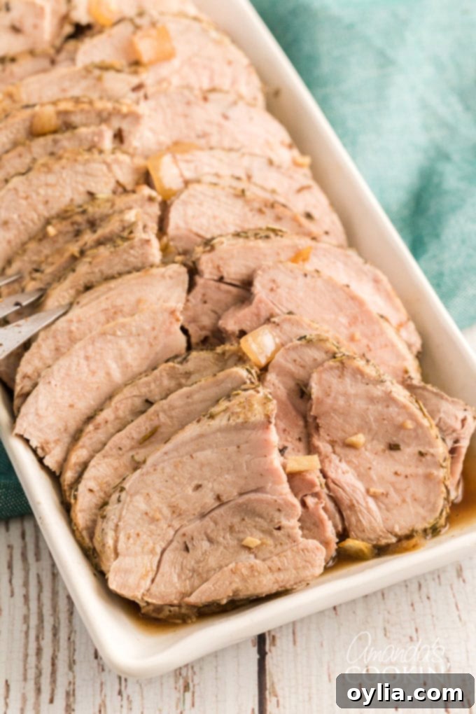 The Ultimate Sirloin Pork Roast Recipe 2 slices of pork roast on a platter