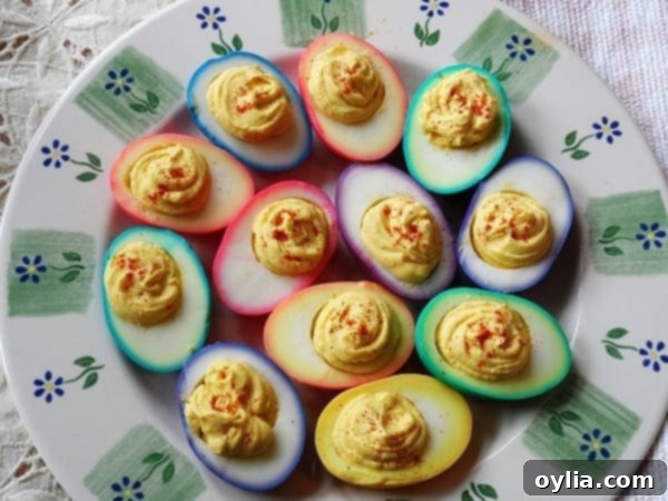 An overhead photo of rainbow deviled eggs on a platter.