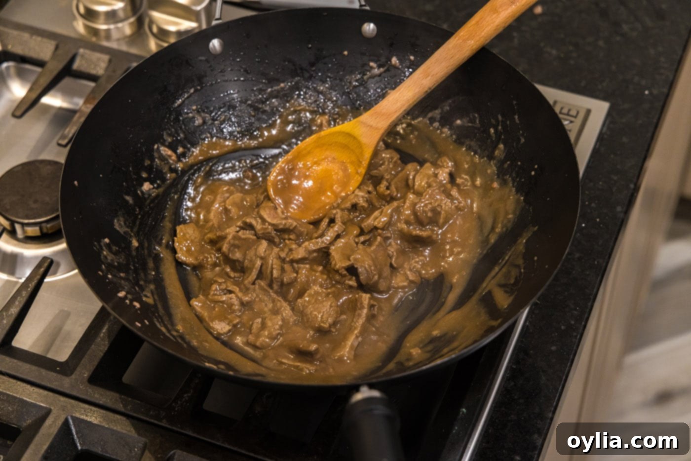 Finished beef teriyaki in a wok, rich and glossy, ready to be served