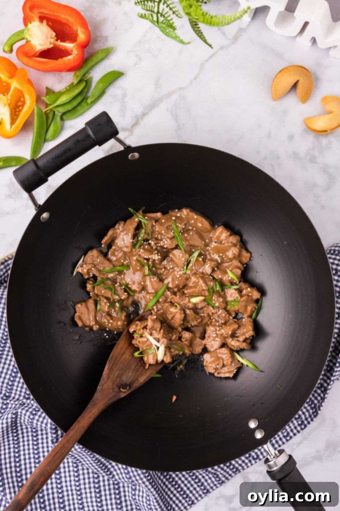 Teriyaki Glazed Beef 10 Close-up of Beef Teriyaki in a wok with a spoon, showing the rich, thick sauce coating the beef
