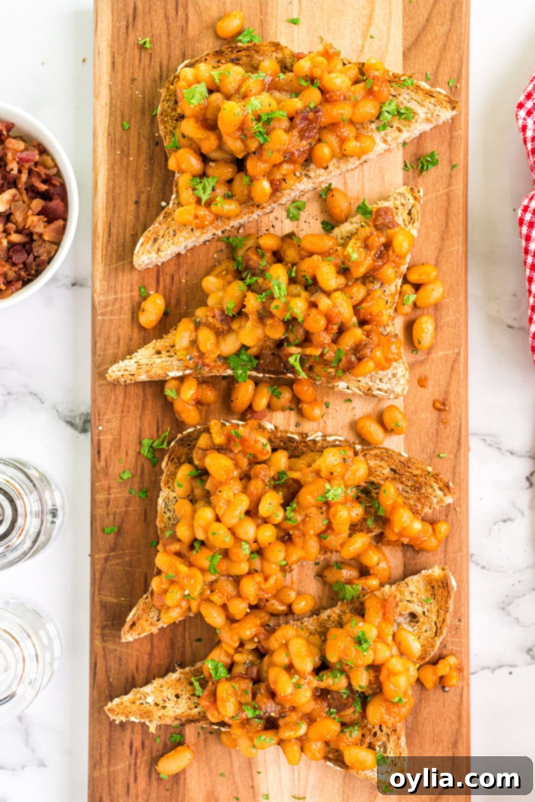 Overhead photo of Beans on Toast on a wooden serving platter