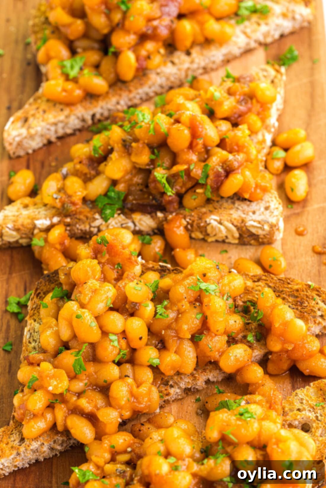 Close up photo of Beans on Toast on a wooden platter