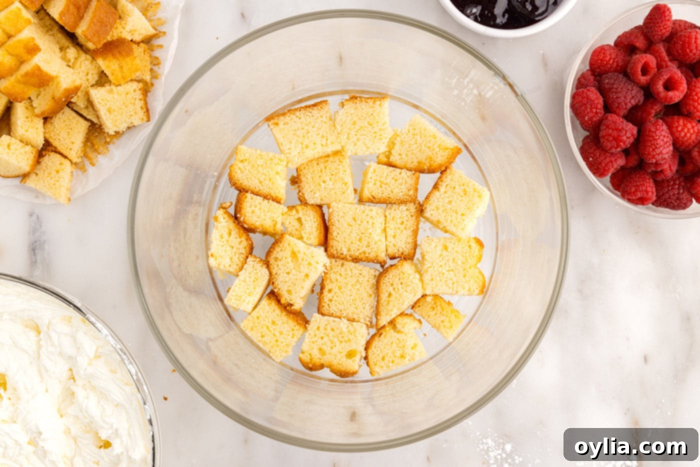 pound cake cubes on the bottom of a trifle bowl