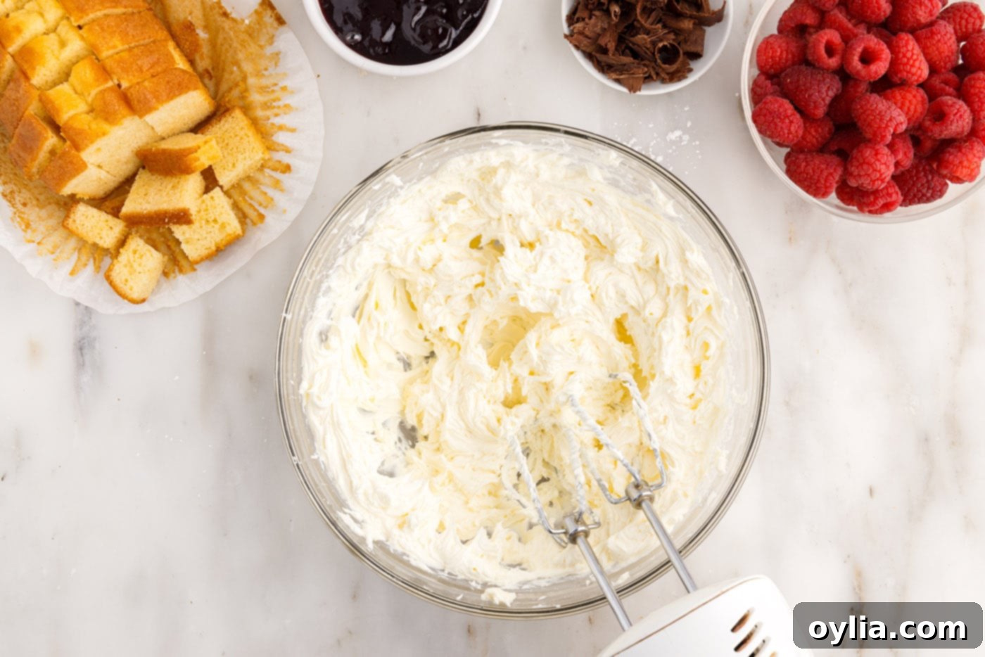 cream cheese mixture in a bowl with a mixer