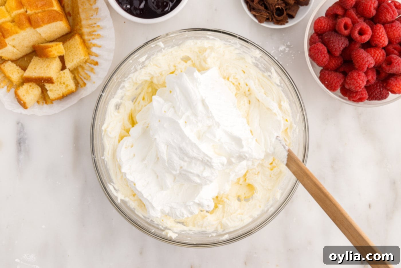 folding whipped cream into cream cheese mixture