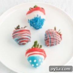 Four Patriotic Chocolate Covered Strawberries on a plate