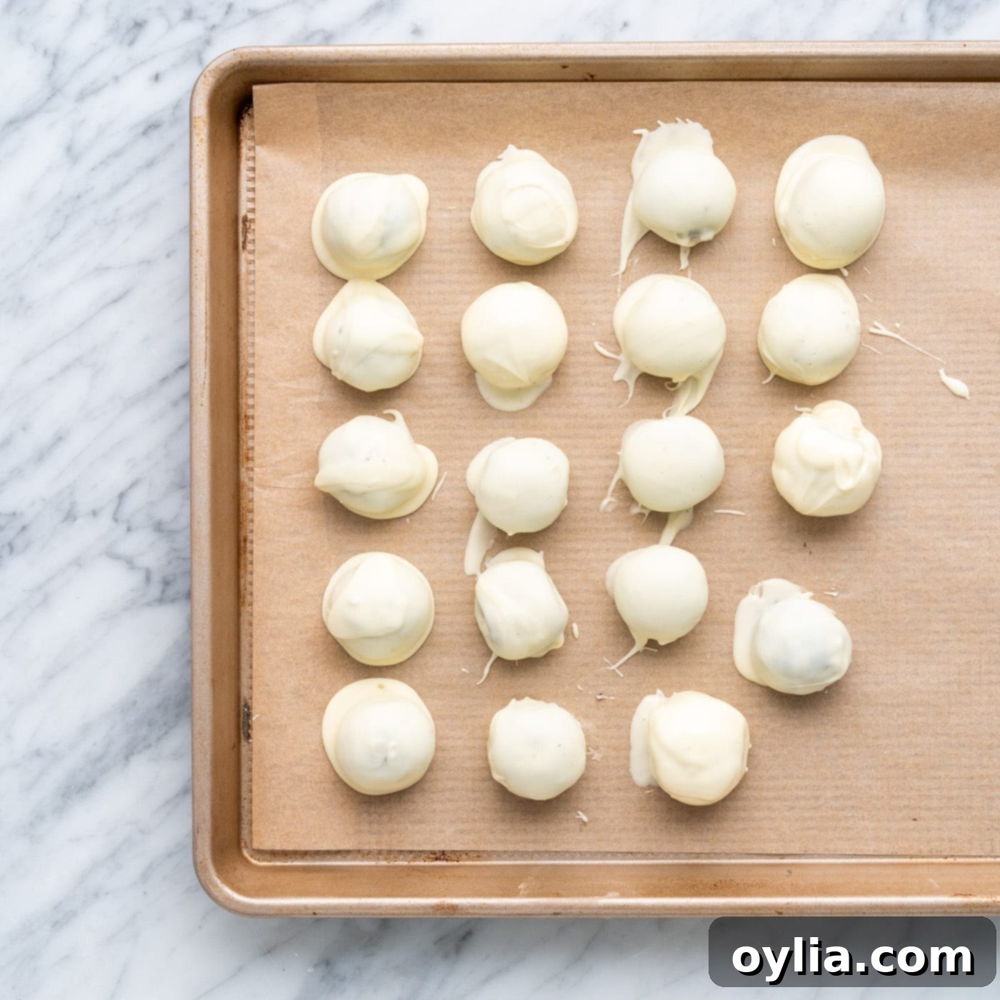 white chocolate oreo truffles on a baking sheet