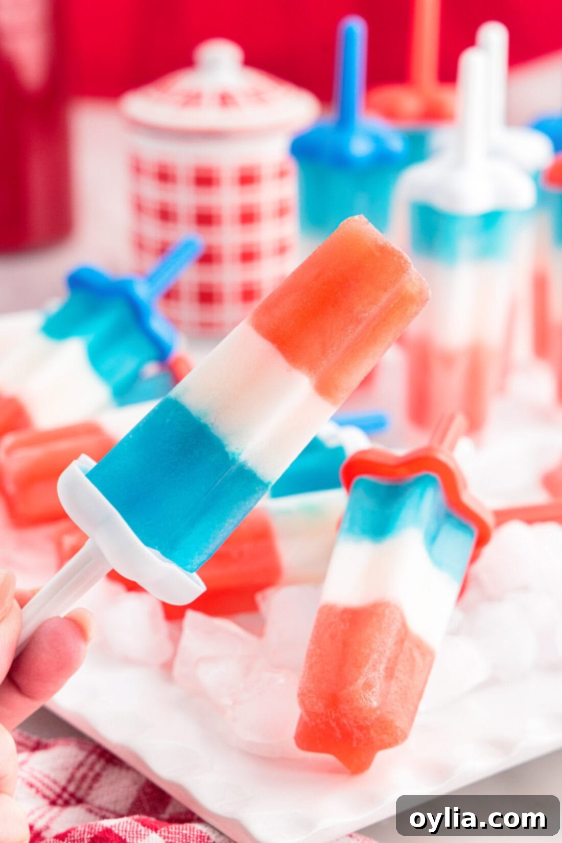 Stars and Stripes Rocket Pops 2 Homemade patriotic bomb pops are a refreshing frozen treat for the Fourth of July. With sweet layers of cherry and blue raspberry Kool-Aid plus limeade, these popsicles are just like the original!