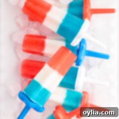 Stars and Stripes Rocket Pops 10 Patriotic Bomb Pops resting over ice, ready to be served at a festive gathering.