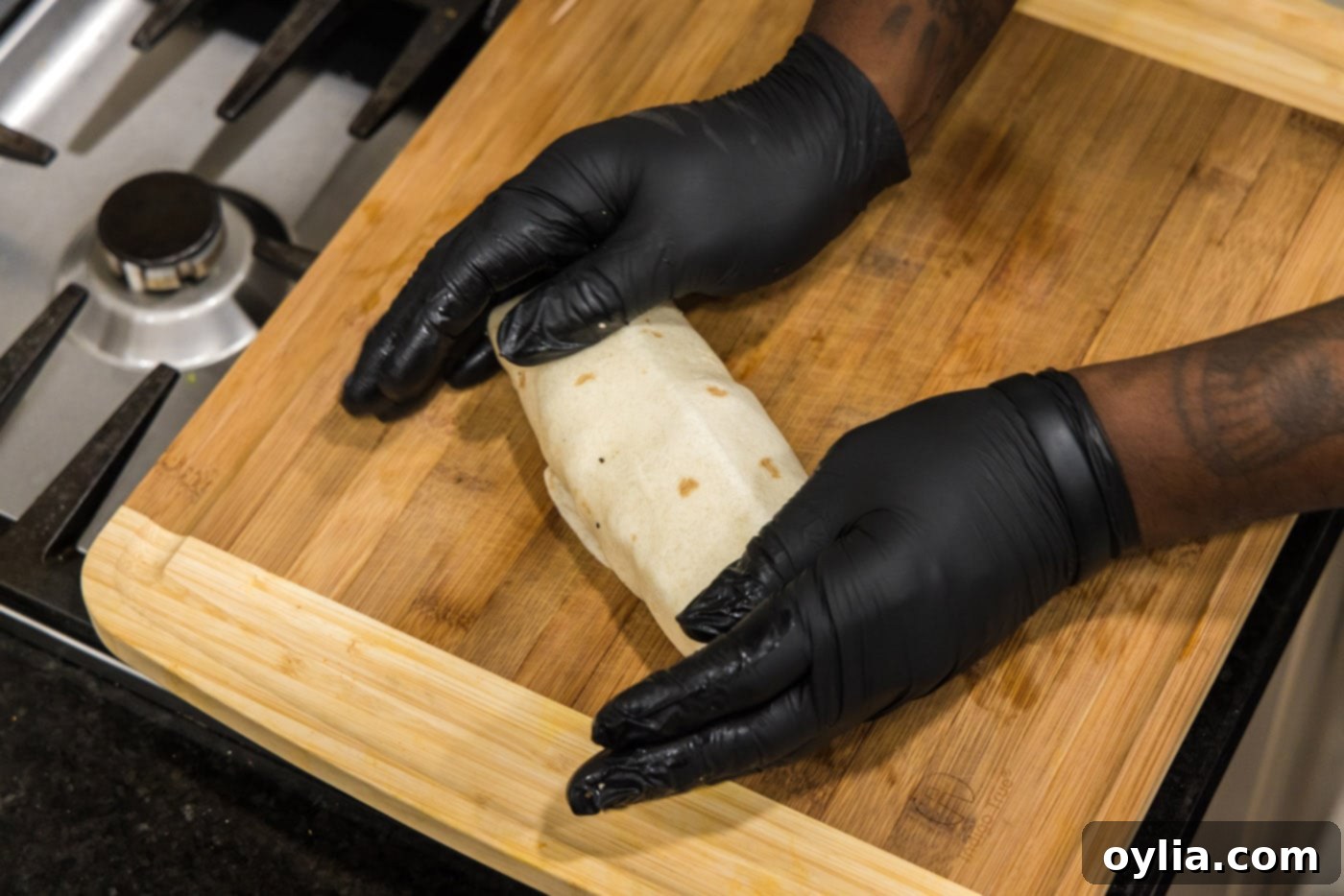 hands holding chicken bacon ranch wrap