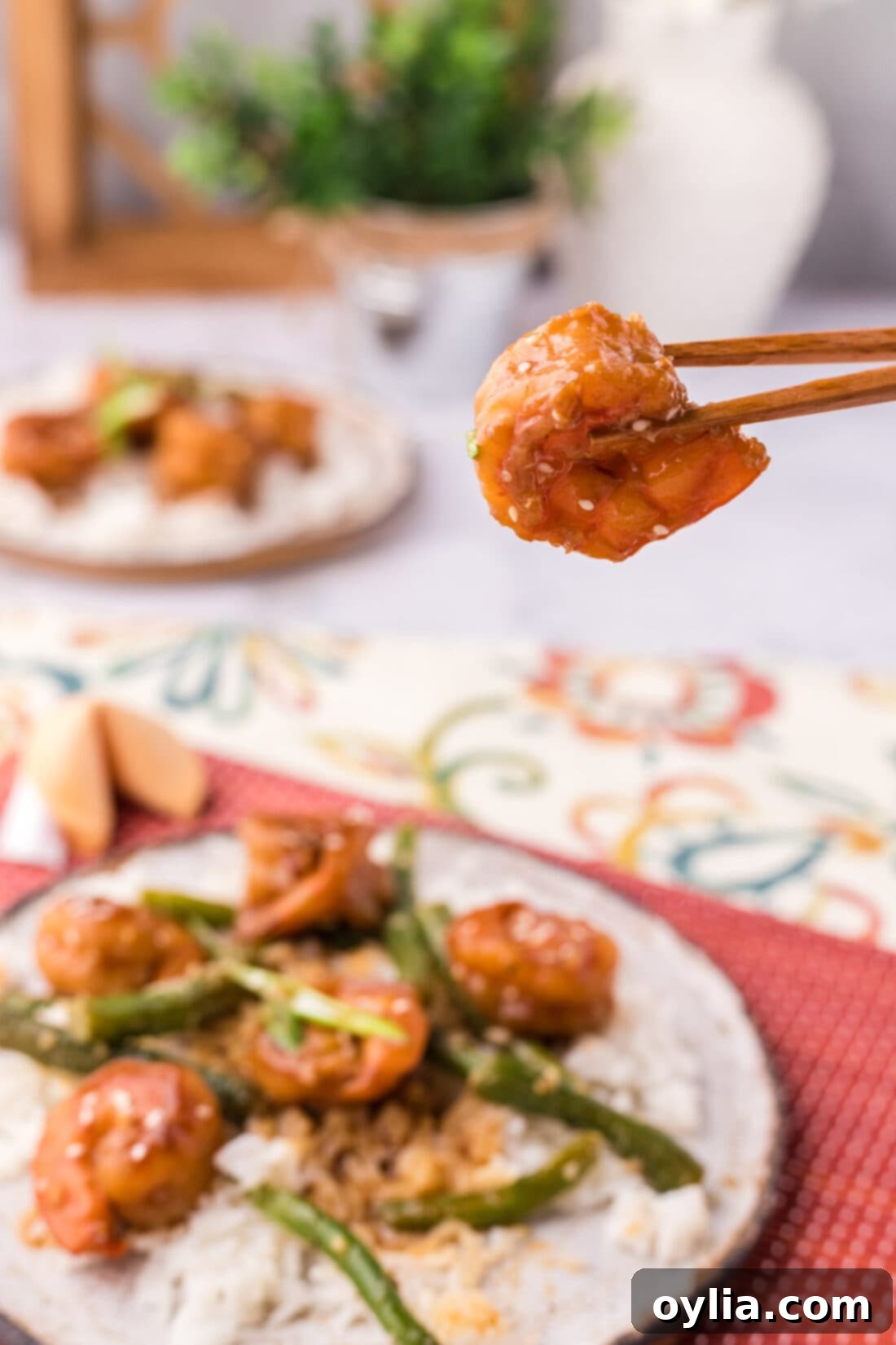 Chopsticks holding a Hunan Shrimp