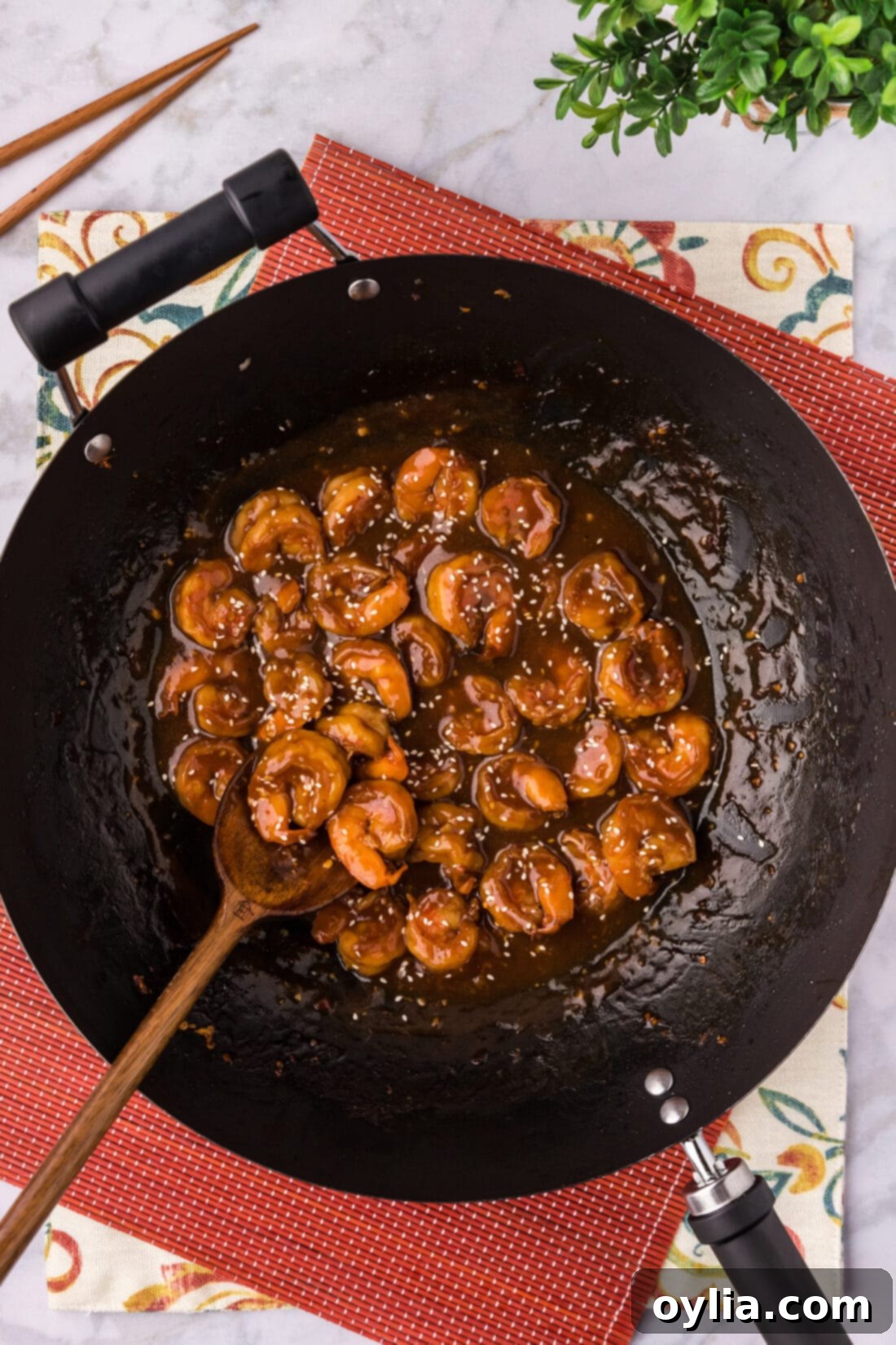 Skillet of Hunan Shrimp with a spoon in it