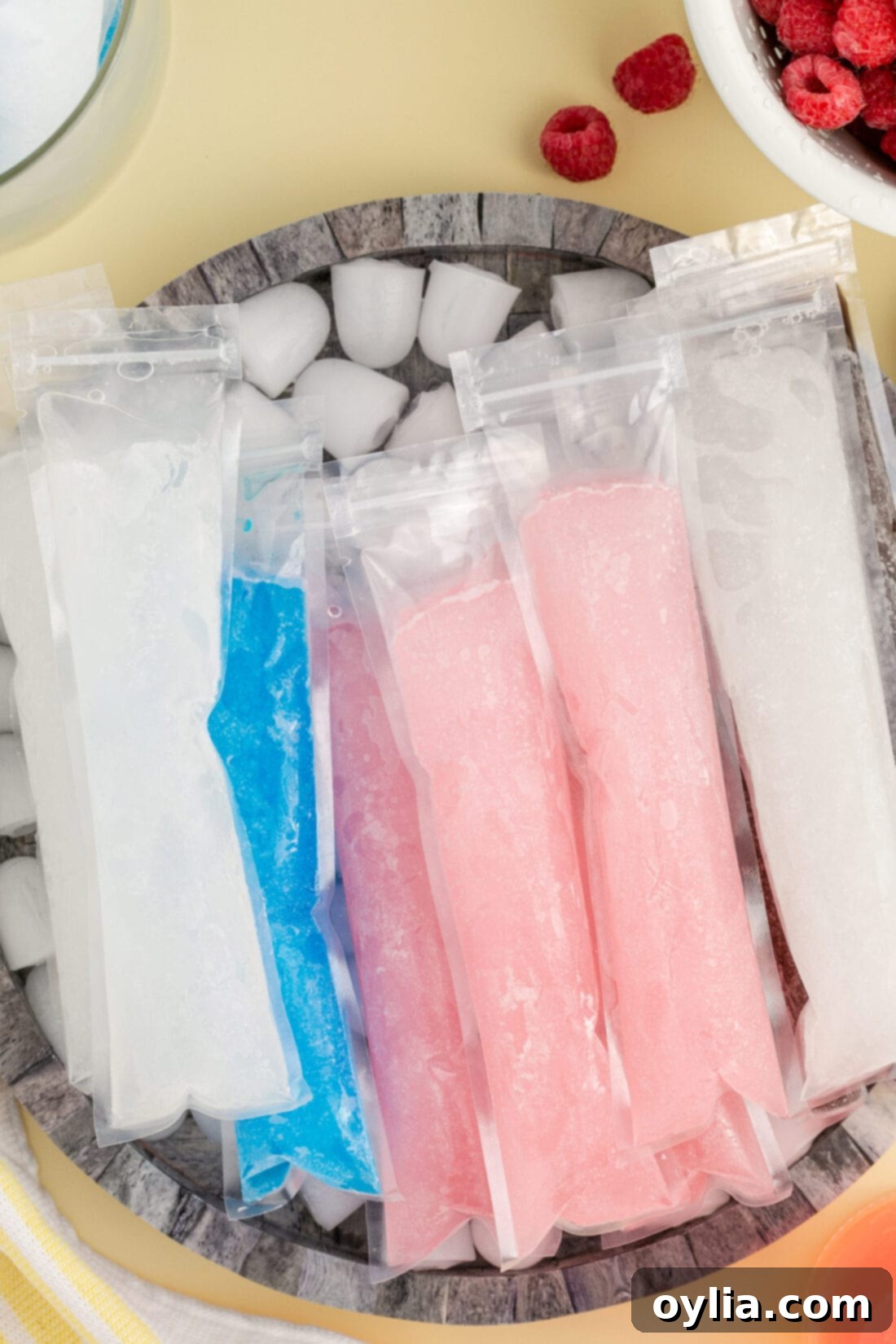 Boozy Ice Pops resting in a bowl of ice