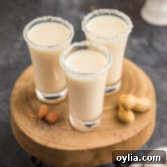 Three Salted Nut Roll Shots on a wooden tray