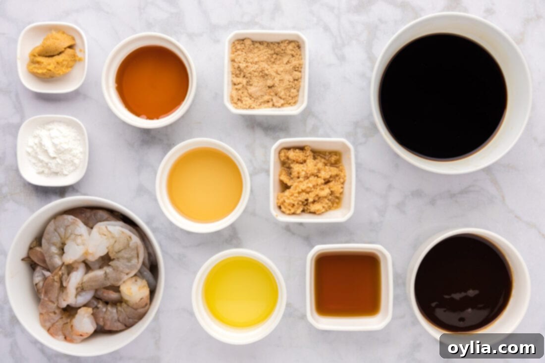 All ingredients laid out for making Teriyaki Shrimp, including fresh shrimp, various sauce components, and olive oil.