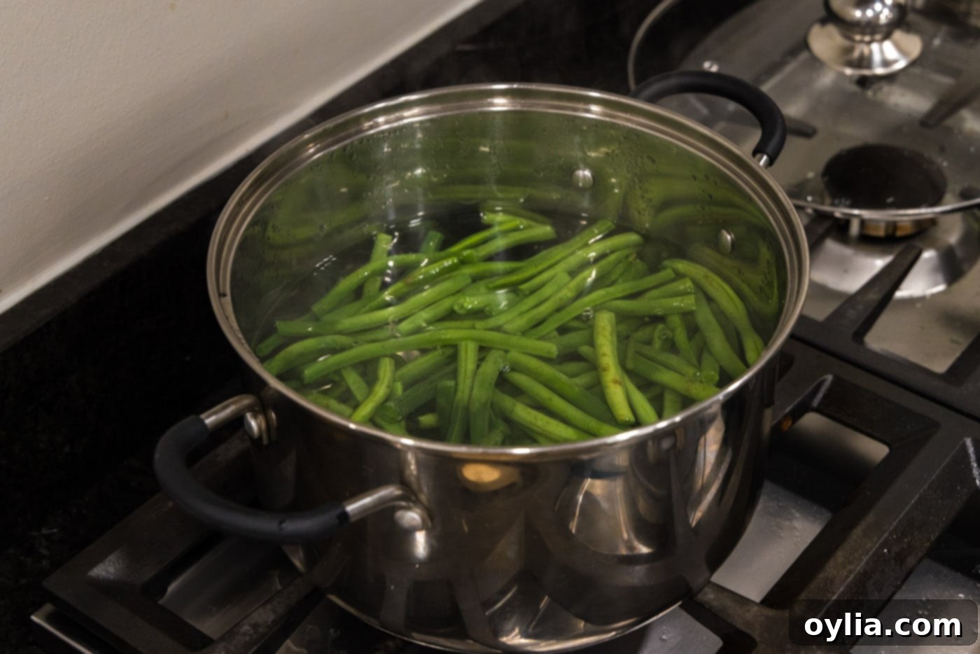 boiling green beans in a pot