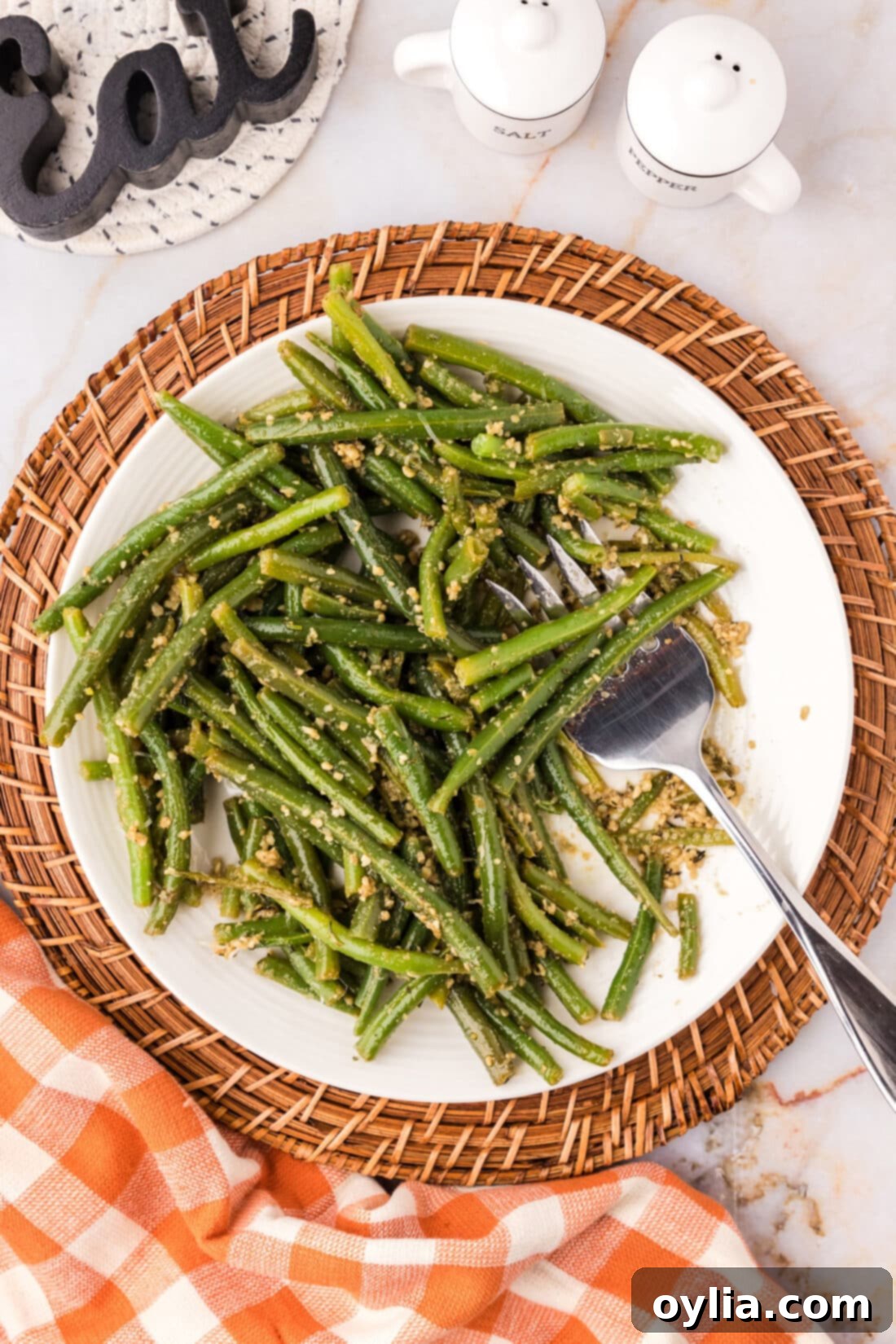 Garlic Green Beans on a plate with a fork