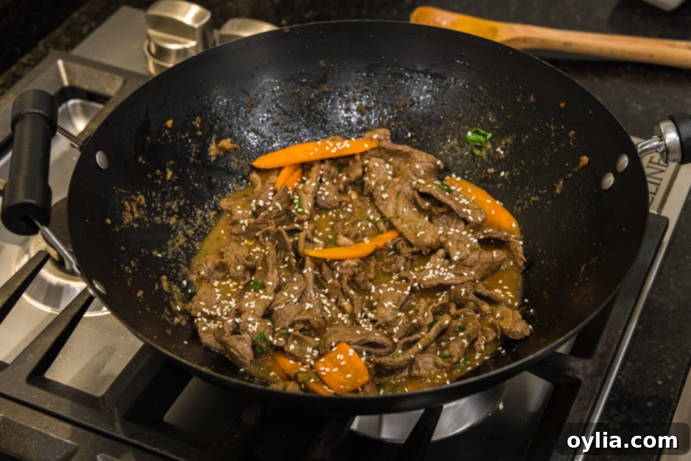 Finished Beef Bulgogi in a wok, ready to be served, showing the mix of meat and vegetables.