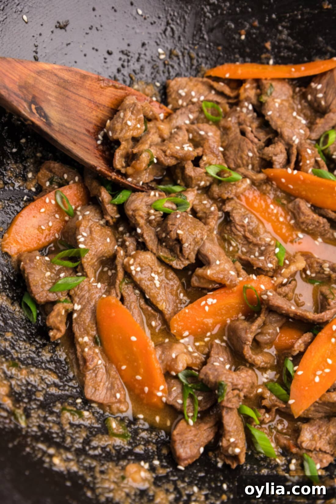 Sweet and Savory Korean BBQ Beef 3 Close-up shot of sizzling Beef Bulgogi cooking in a hot wok, showing the delicious caramelization of the meat.