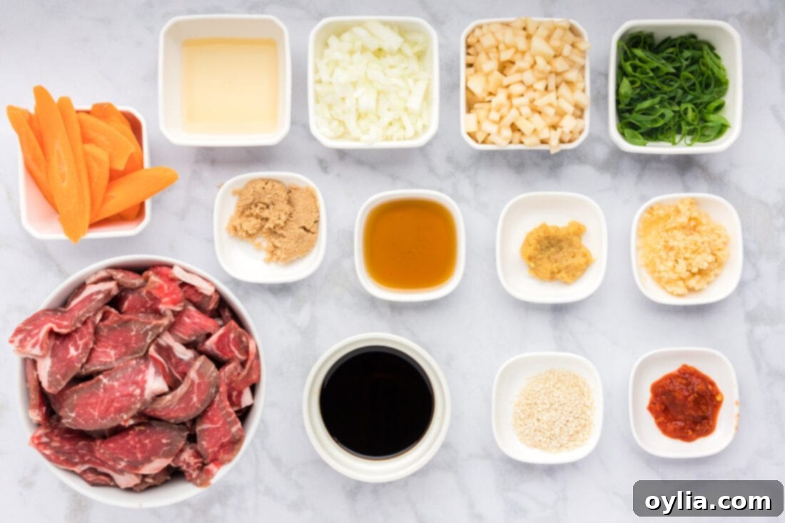 Sweet and Savory Korean BBQ Beef 4 All the fresh ingredients laid out for making Beef Bulgogi, including sliced ribeye, carrots, green onions, and marinade components.