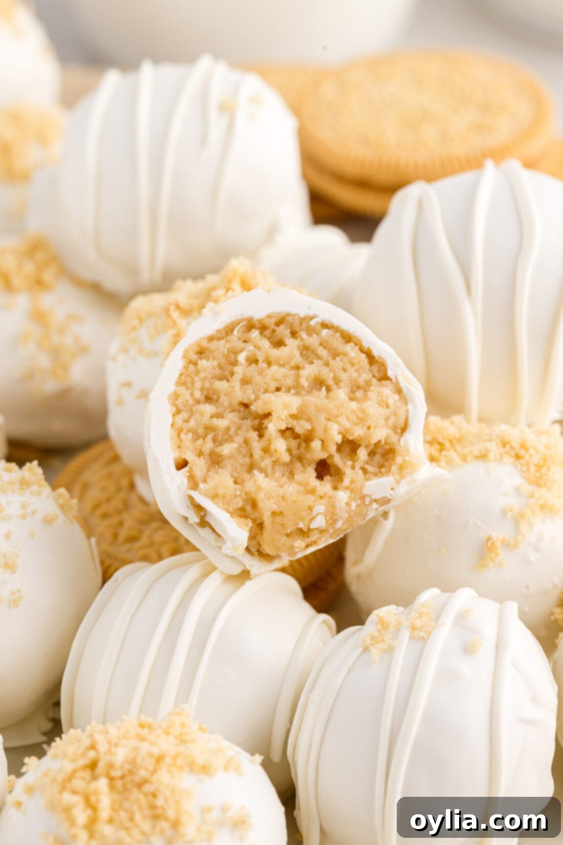 Golden Oreo Truffles 2 Close up photo of a Golden Oreo Truffle with a bite taken out, showing the creamy golden interior