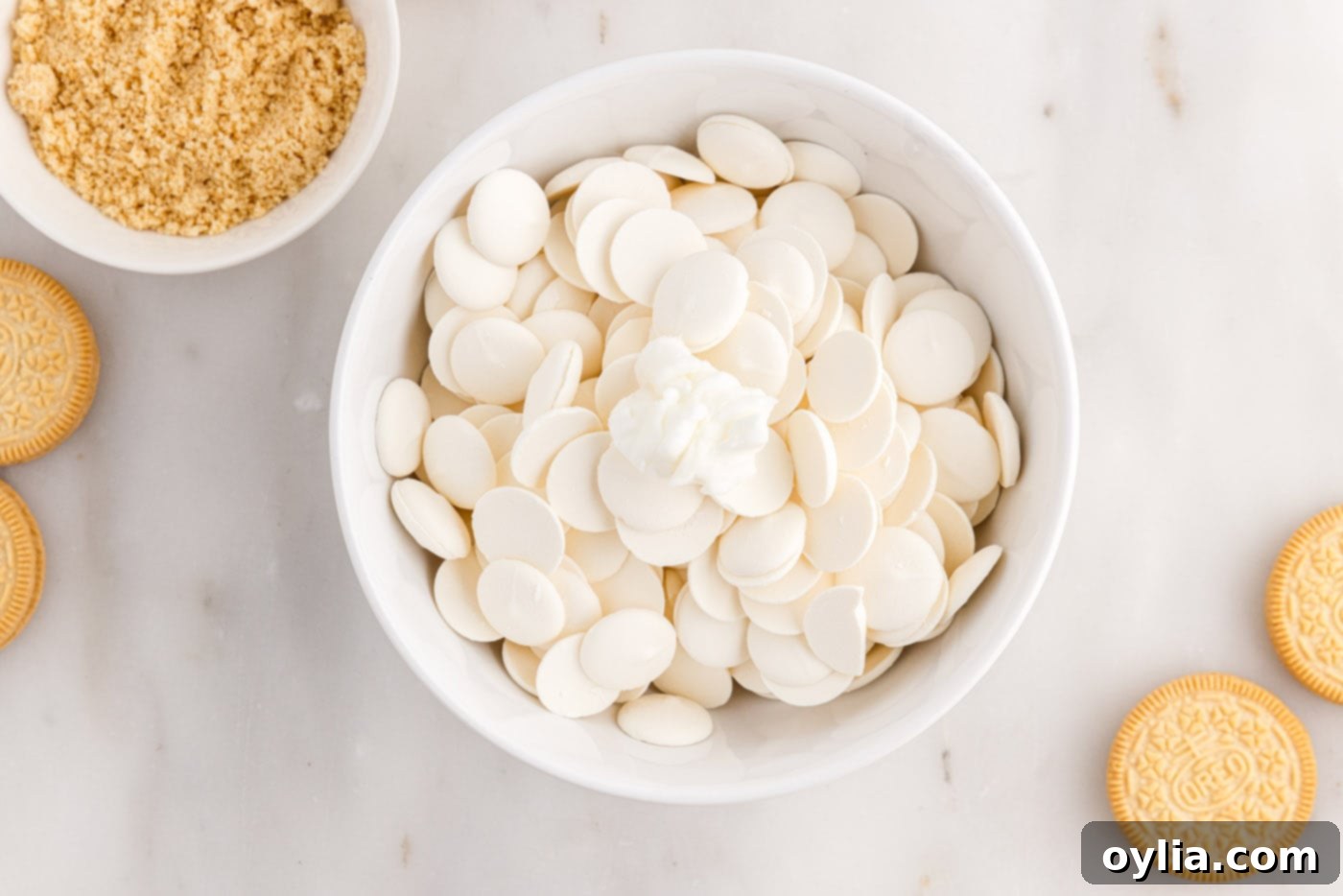 White chocolate melting wafers in a microwave-safe bowl