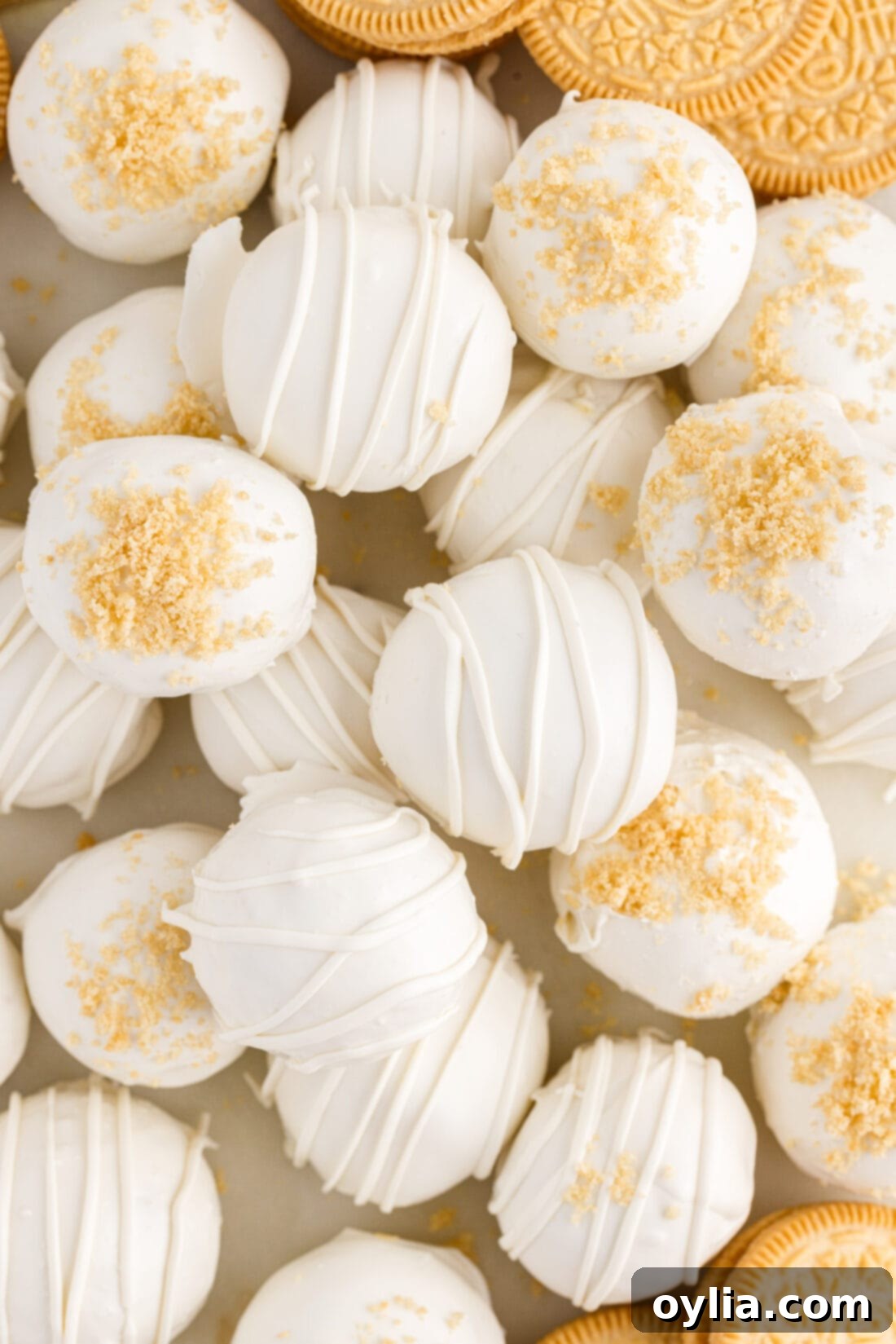 Golden Oreo Truffles 17 Assortment of Golden Oreo Truffles with various decorations like drizzles and sprinkles on a platter